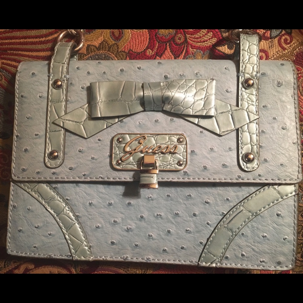 Nearly new Guess special occasion purse.